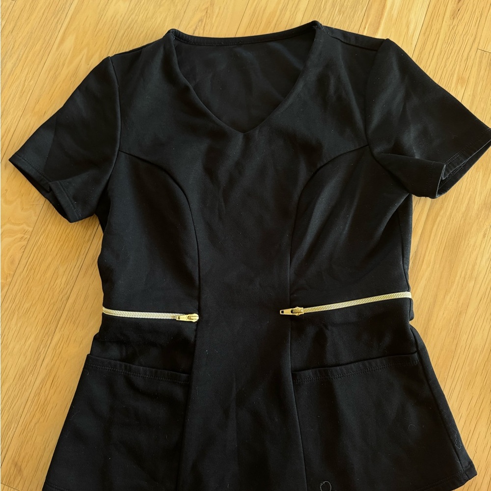 Black Jaanuu Scrub top with gold zipper accents
